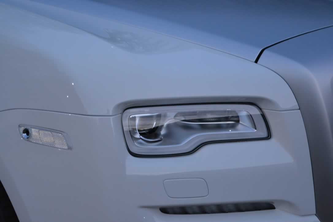 White Rolls-Royce Ghost II headlights closeoup