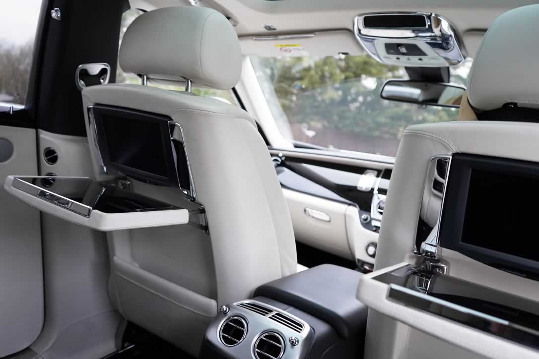 White Rolls-Royce Ghost II interior drop down tables with TV screens