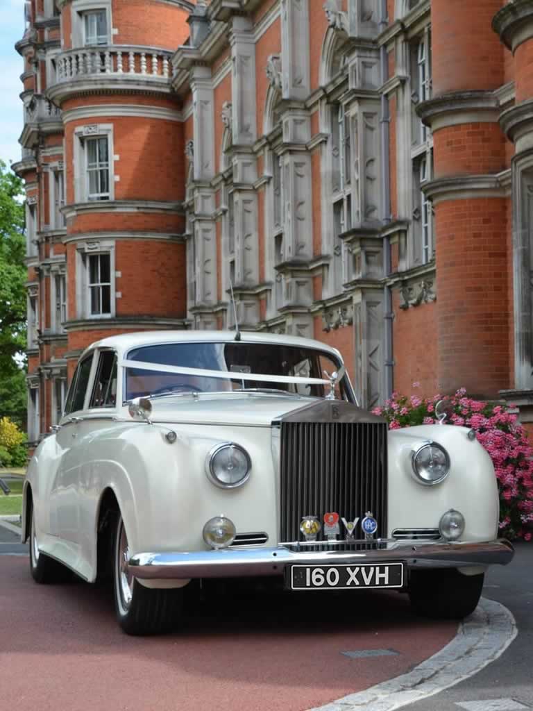 Rolls-Royce Silver Ghost with weddings ribbons on bonnet at wedding venue