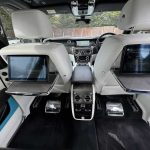 White Rolls-Royce Cullinan interior TV screens in back of front seats